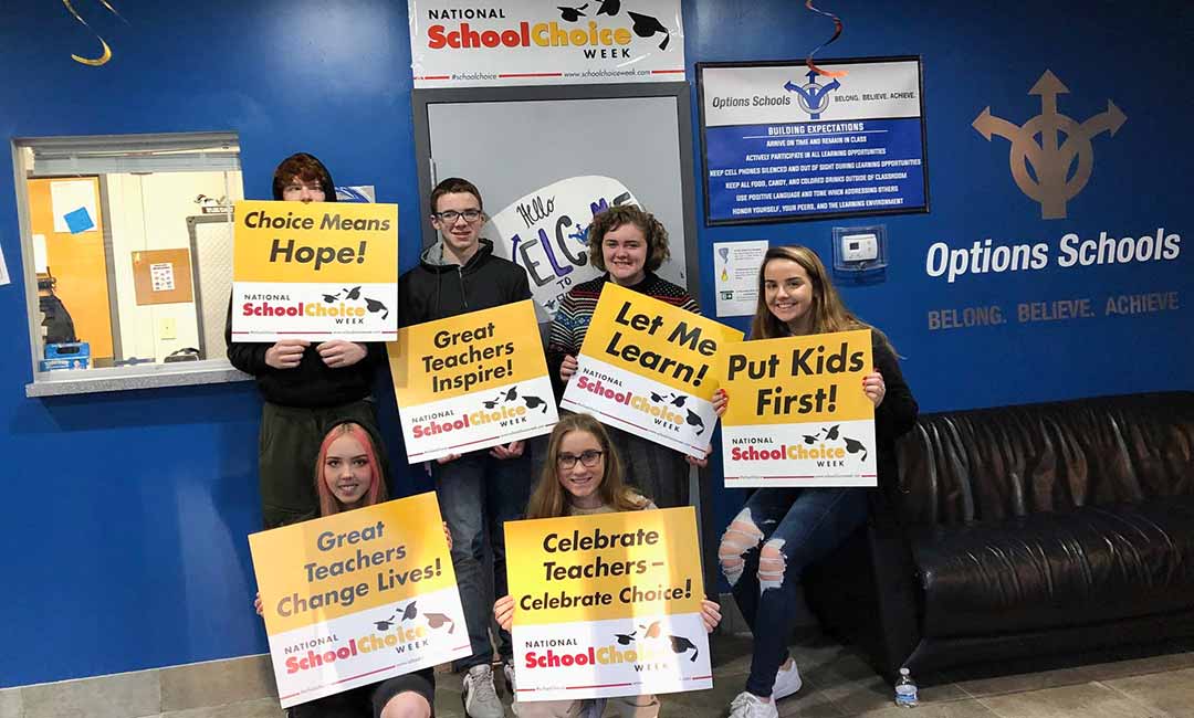 Options Charter School students with signs